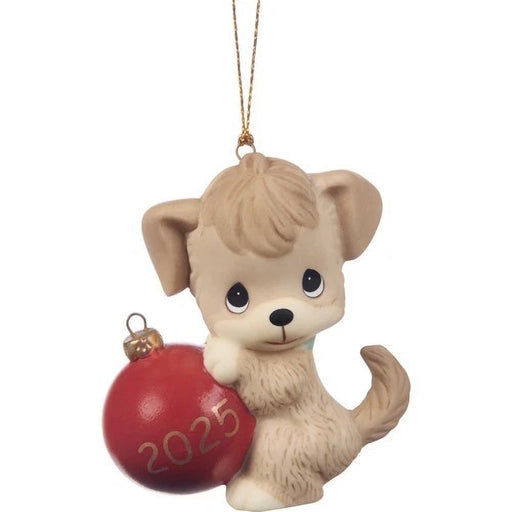 Dog-shaped Christmas ornament holding a red ball with '2025' on a white background