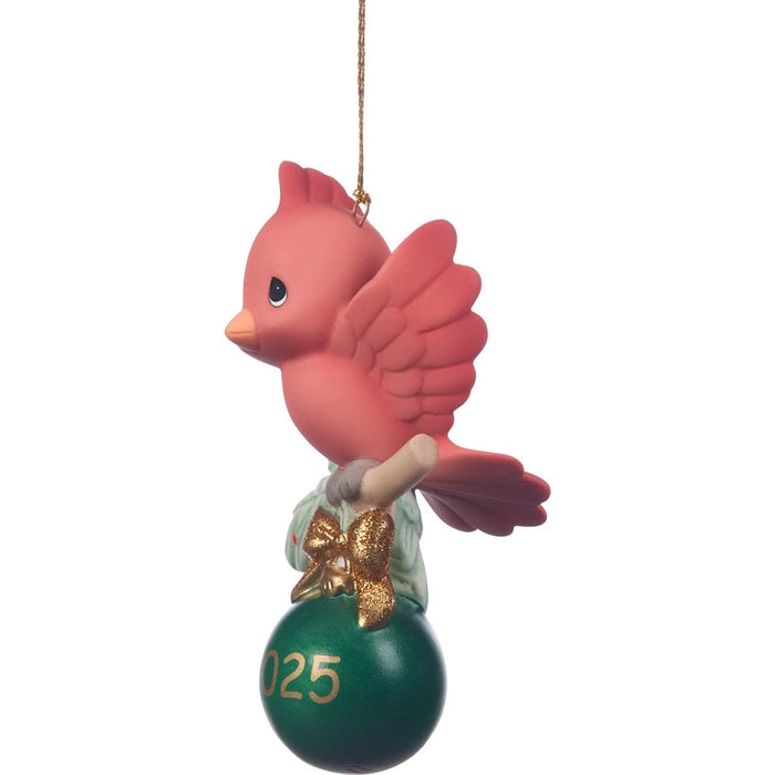 Red bird ornament with a green ball and gold number '25' on a white background