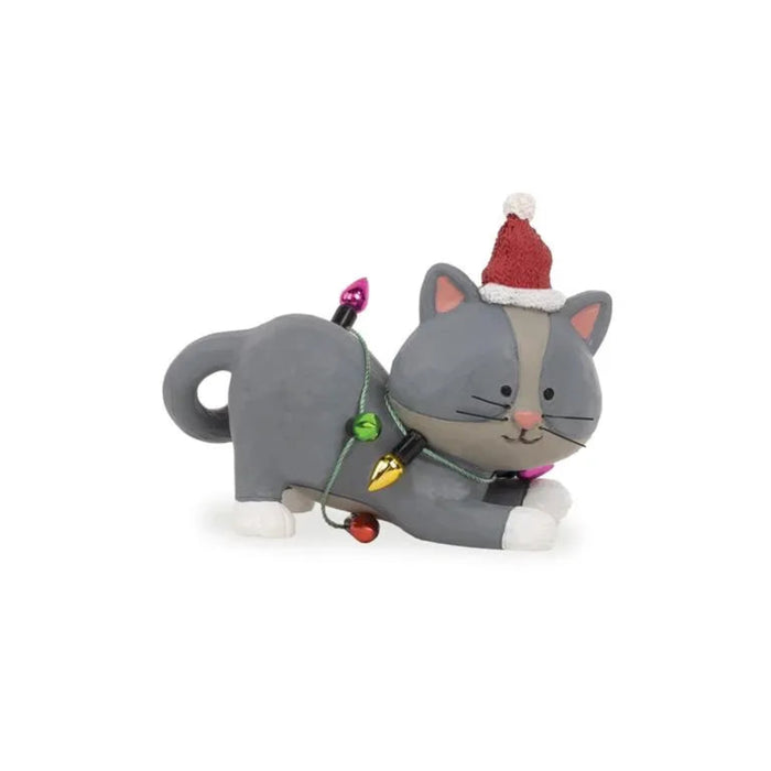 Gray cat-shaped holiday figurine  with a Santa hat on a white background
