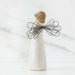 Ceramic angel figurine with wire wings on a white background