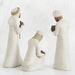 Three white ceramic figures with different poses on a white background