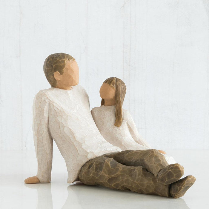 sculpture of a Father and daughter  sitting together on a white background