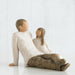 sculpture of a Father and daughter  sitting together on a white background