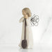 Angel figurine with a shovel on a white background