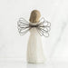 Decorative angel figurine with wire wings on a white background