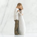 Statue of two people embracing on a white background