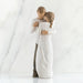 Statue of a couple embracing on a white background