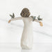 Ceramic angel figurine with outstretched arms and three birds on a white background