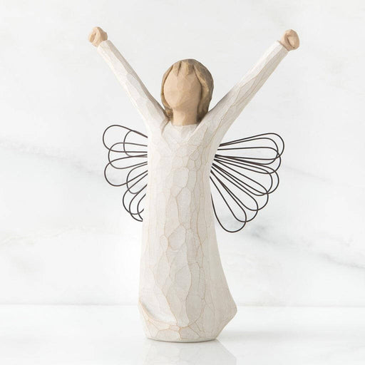 Angel figurine with outstretched arms on a white background