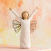 Decorative figurine of a woman with outstretched arms against a pastel background
