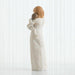 Statue of a woman holding a child on her back against a white background
