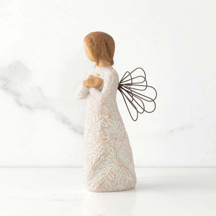 Decorative figurine of a woman holding a butterfly on a white background