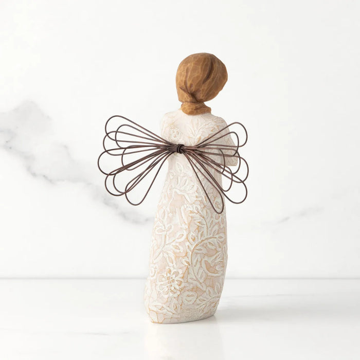 Decorative angel figurine with a wire bow on a white background