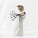 Decorative angel figurine with wire wings on a white background