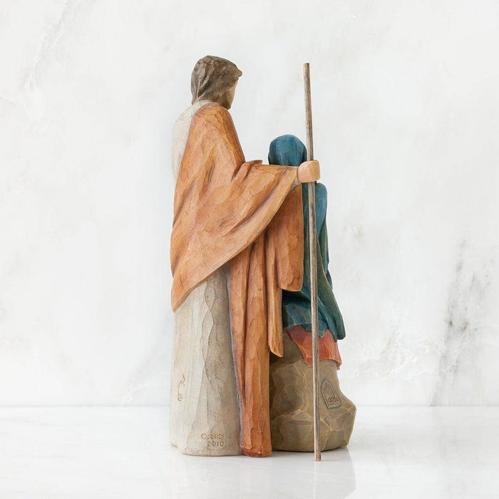 n statue of Joseph with Mary and the  child on a white background