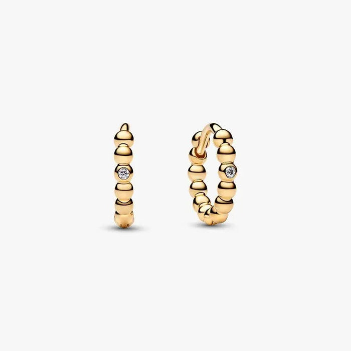 PANDORA Beaded Huggie Earrings in 14k gold plating with delicate bead detailing and a sparkling center stone