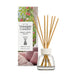Yankee Candle Home Sweet Home reed diffuser with natural wood reeds in a clear glass bottle, shown in front of its illustrated packaging box on a white background.