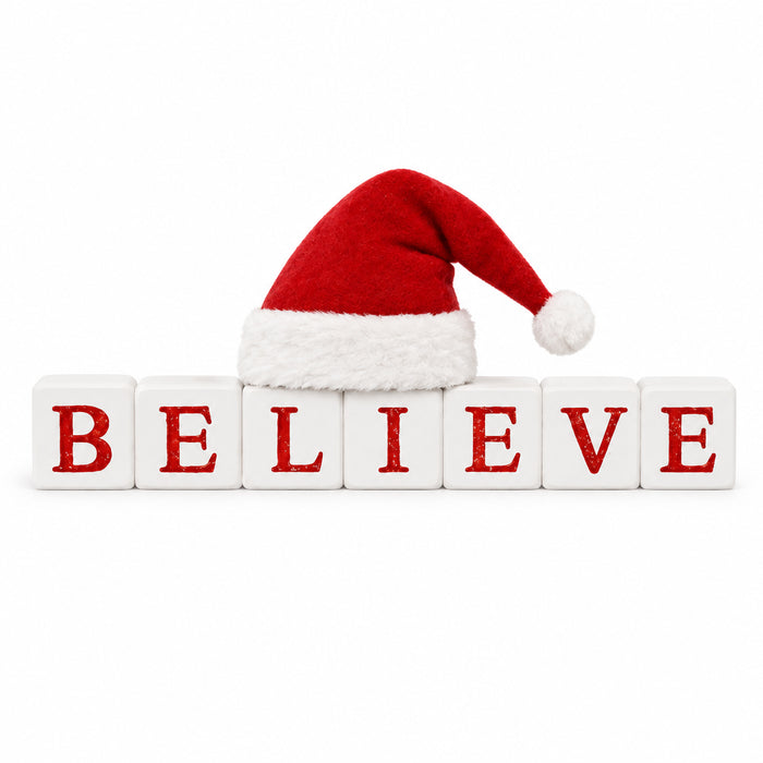 Blossom Bucket Holly Days decoration with white blocks spelling “BELIEVE” in red, topped with a red and white Santa hat.