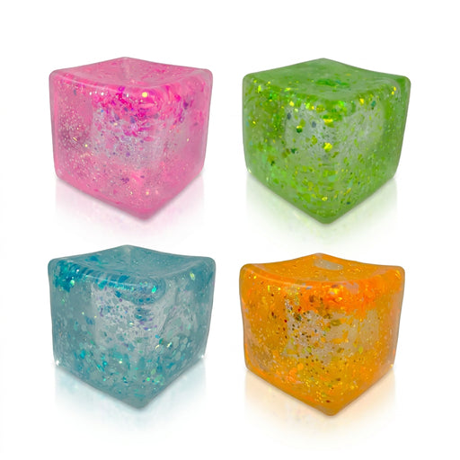 Four translucent cube-shaped squishy toys in pink, lime green, aqua blue, and orange, with glitter-like flakes inside, arranged in two rows against a black background.