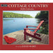 Cottage Country 2026 calendar with a red chair on a dock over a lake, artwork by David Ward.