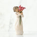 Statue of a woman holding pink flowers against a white background