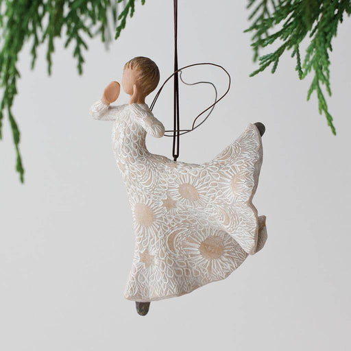 Decorative hanging figure with floral patterns on a plain background