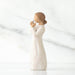 White  figurine of a woman holding a heart on a white background
