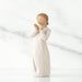 White figurine of a woman holding a delicate heart  on a white background