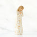 Decorative figure  with gold and white floral patterns on a white background