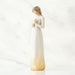 White figurine with a candle  with a gold base on a white background