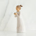 Figurine of a person holding a baby bird on a white background