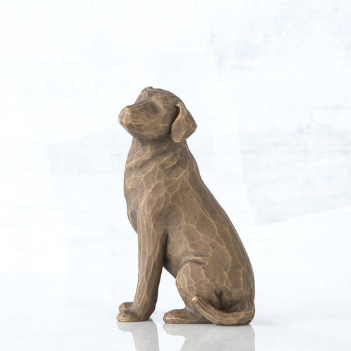 Bronze statue of a dog on a white background