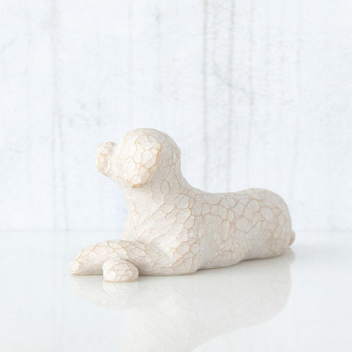 White dog figurine on a light gray background