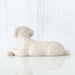 White dog figurine on a white background