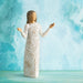 Hand-painted Willow Tree Everyday Blessings figurine featuring a woman with open arms and a cream dress decorated with flowers, leaves, birds, and butterflies on a blue water color background.