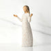 Statue of a woman in a white dress with a textured pattern on a light gray background