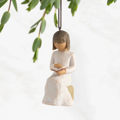 A girl reading under a willow tree, depicted as a decorative ornament, showcasing a serene and whimsical scene.