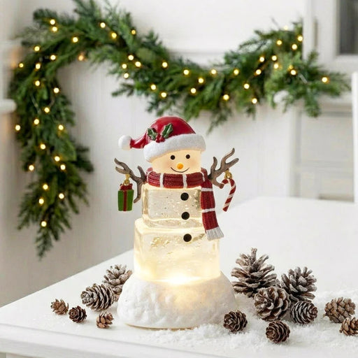5.5-inch lighted water lantern with an ice cube snowman and swirling glitter