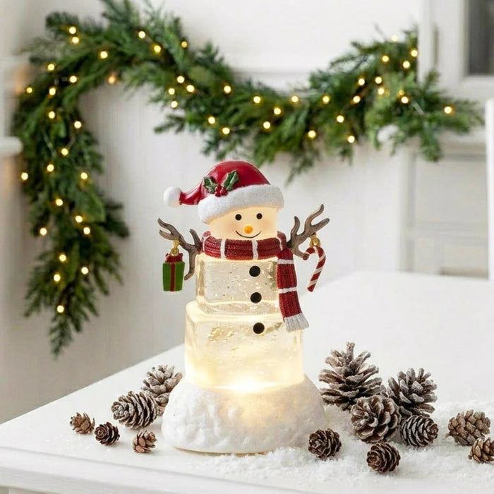 5.5-inch lighted water lantern with an ice cube snowman and swirling glitter