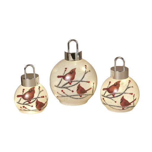 This Gerson lighted glass holiday cardinal ornament features a vibrant red cardinal design set in decorative glass. 