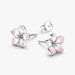 Silver earring with a pink flower design on a white background