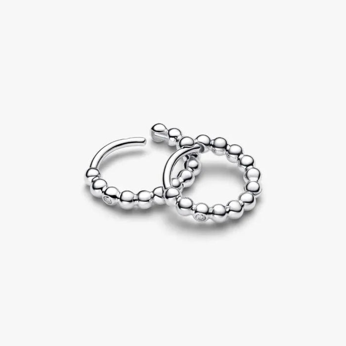 PANDORA Beaded Huggie Earrings in 14k gold plating with delicate bead detailing and a sparkling center stone