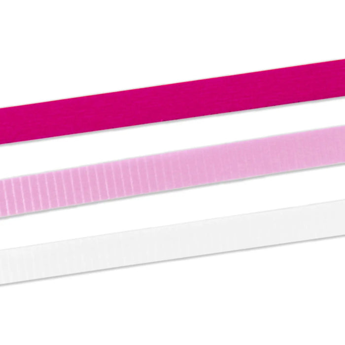 Detailed close‑up of pastel and metallic curling ribbon trio for decorating wrapped gifts