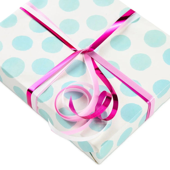 Curling ribbon trio wrapped around a present 