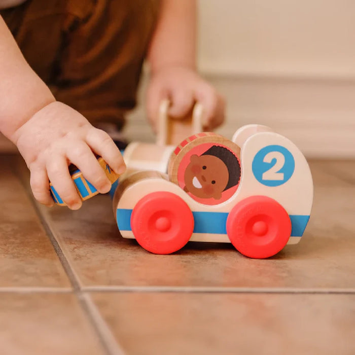 Three wooden toys with cheerful child faces, crafted to inspire imagination and playfulness in children.