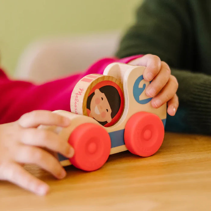 A set of three wooden toys, each with a child's face, designed to be fun and visually appealing for young users.
