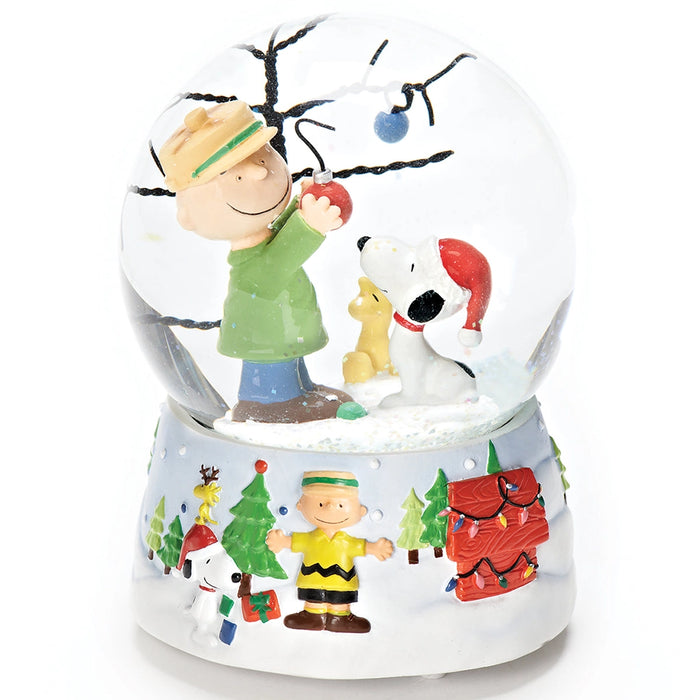 Snow globe with Charlie Brown, Snoopy, and Woodstock characters on a white background
