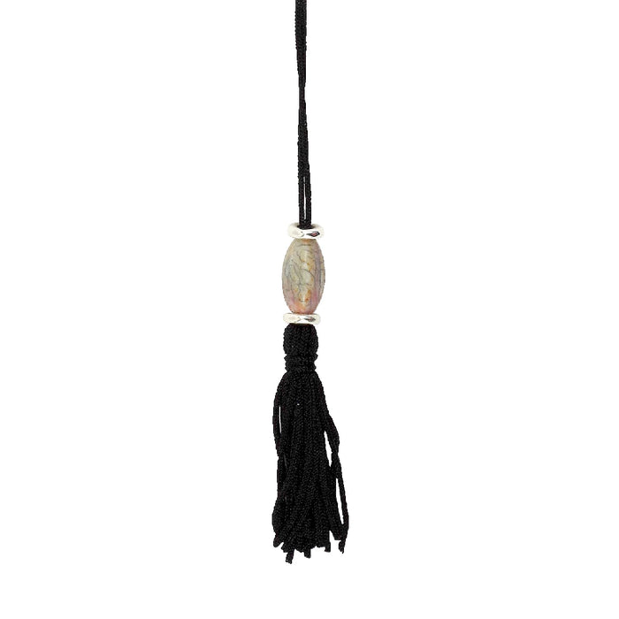 A colorful bookmark that reads "Not meow, I'm reading," adorned with a cute cat design.