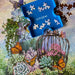 Jigsaw puzzle with a blue puzzle piece holder labeled 'springbek' featuring a garden scene with butterflies.