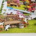 Jigsaw puzzle of a garden scene with flowers and a bench, partially completed.
